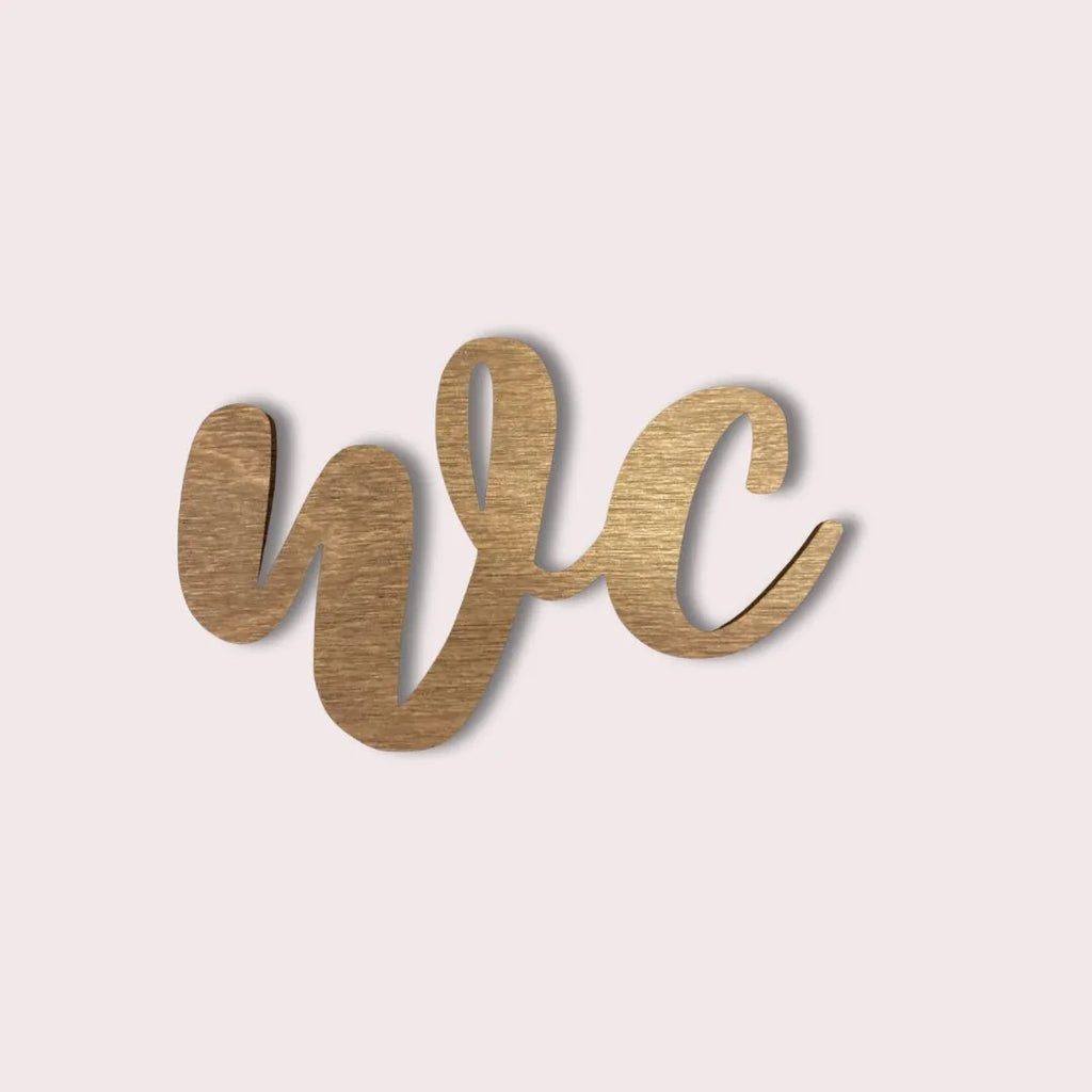 Puinen WC-kyltti